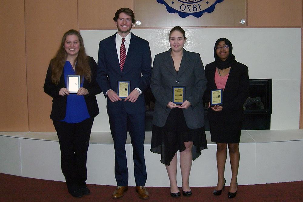 Students holding awards